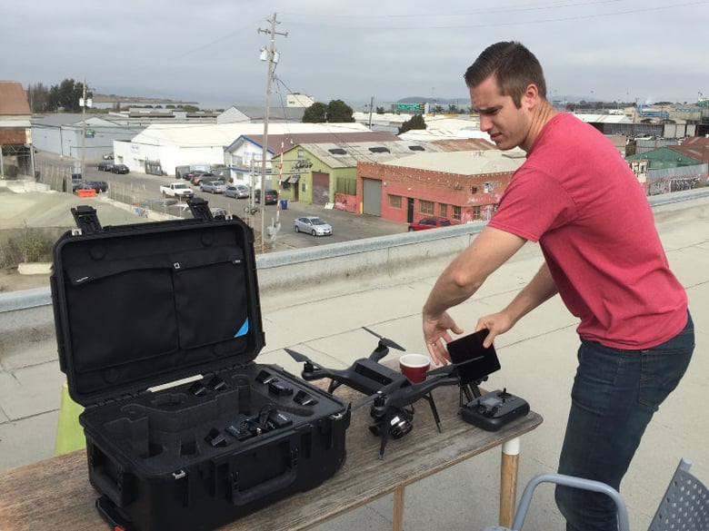 Jeremiah Johnson shows off a drone that can be set to automatically scan and map a given area from the roof of 3D Robotics in Berkeley.